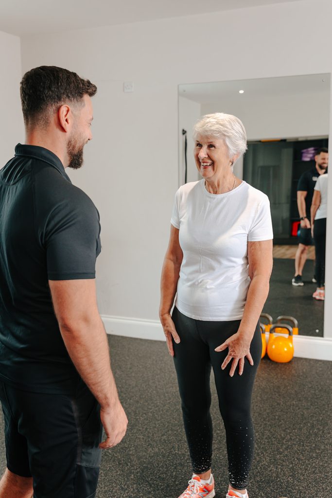 Woman speaking to trainer