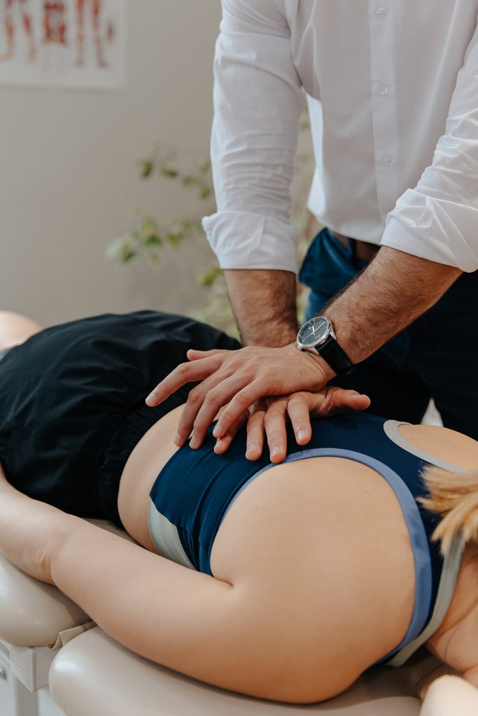 Patient receiving back massage to improve posture