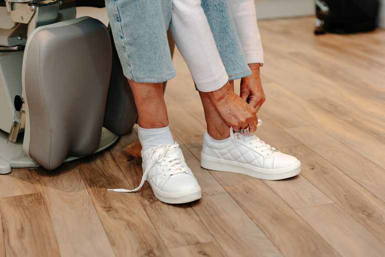 Person tying their shoelace