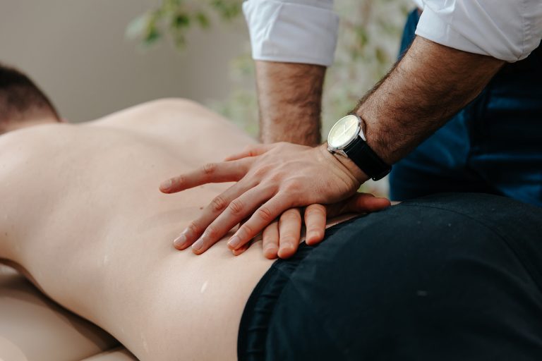 Patient receiving lower back massage at Hatt Clinic