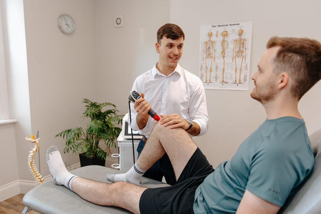 Man receiving Shockwave Therapy on knee