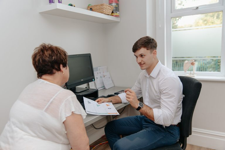 Physio discussing treatment plan with patient