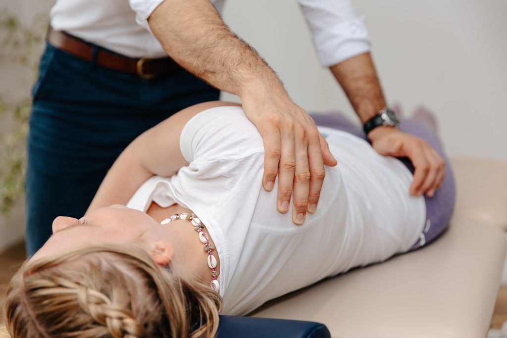 Physiotherapist treating patient