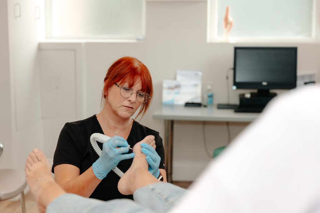 Podiatrist treating foot