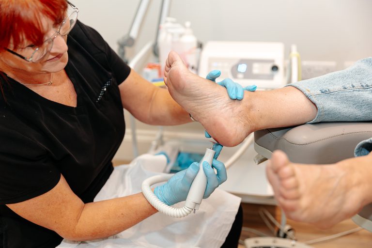 Podiatrist treating foot