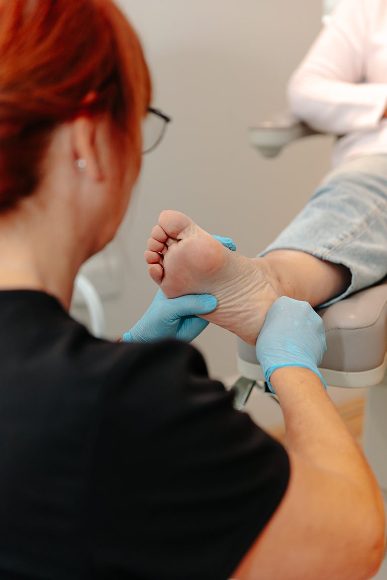 Podiatrist examining foot
