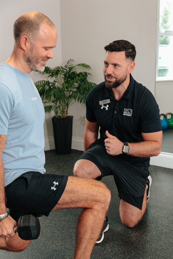 Man doing lunges whilst holding weights